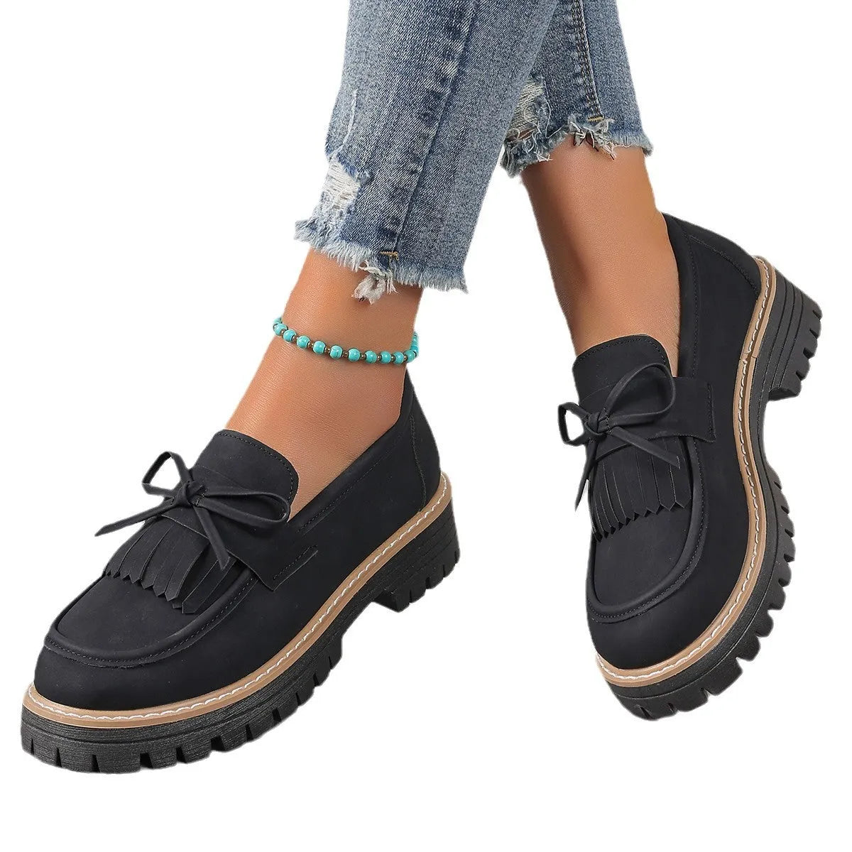 Plus size women's black loafers with tassel decoration and bowknot detail on round toe