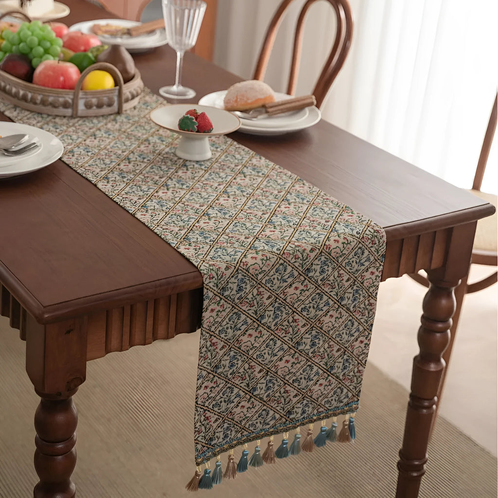 Nordic jacquard bouquet pattern table runner with striped design and decorative tassel fringe in dark blue