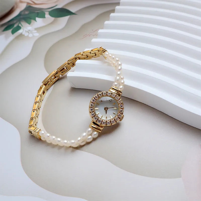 Women's light gold freshwater pearl bracelet watch with 18mm round dial and stainless steel construction