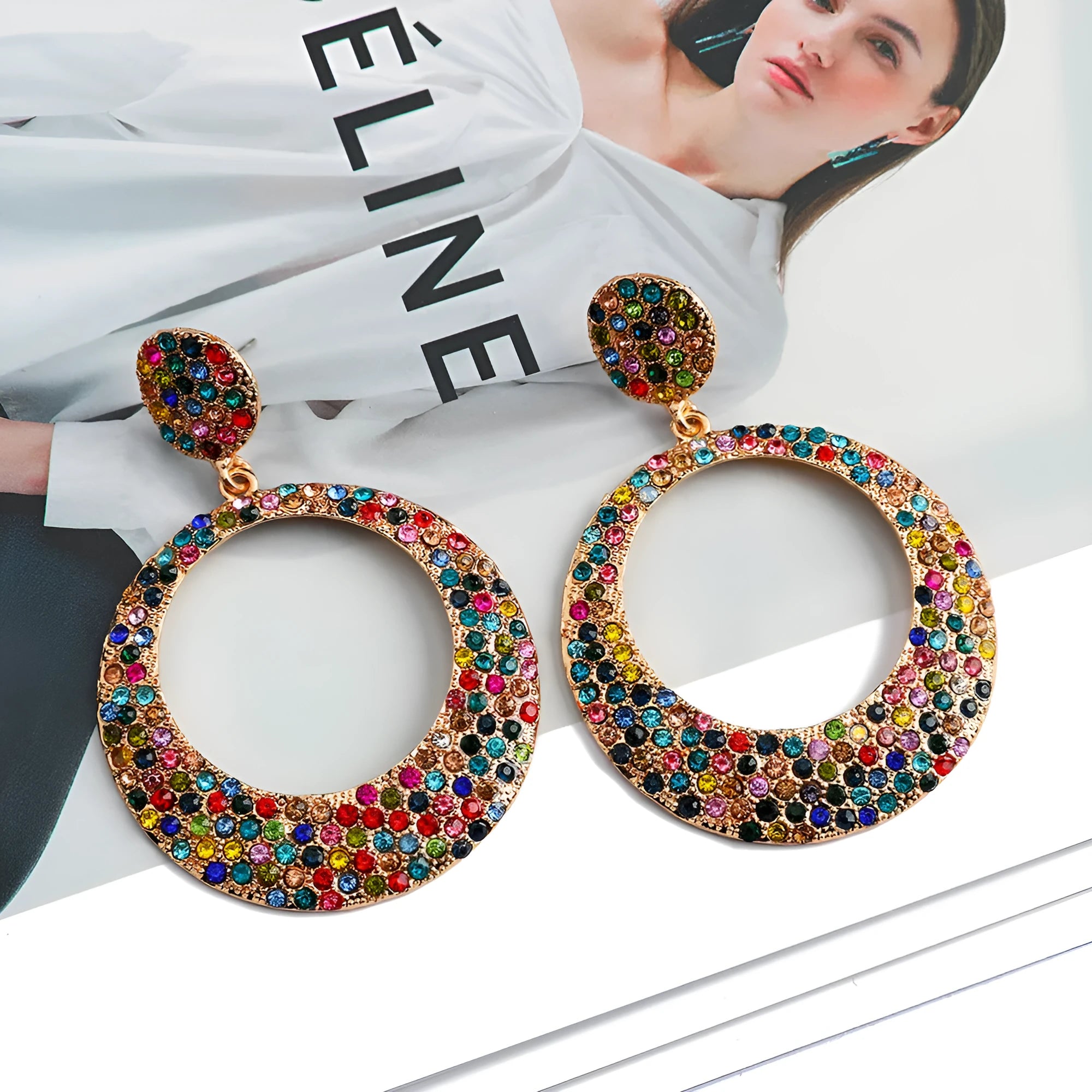 Cartoon style metal earrings with colourful diamond decorations on large round pendants