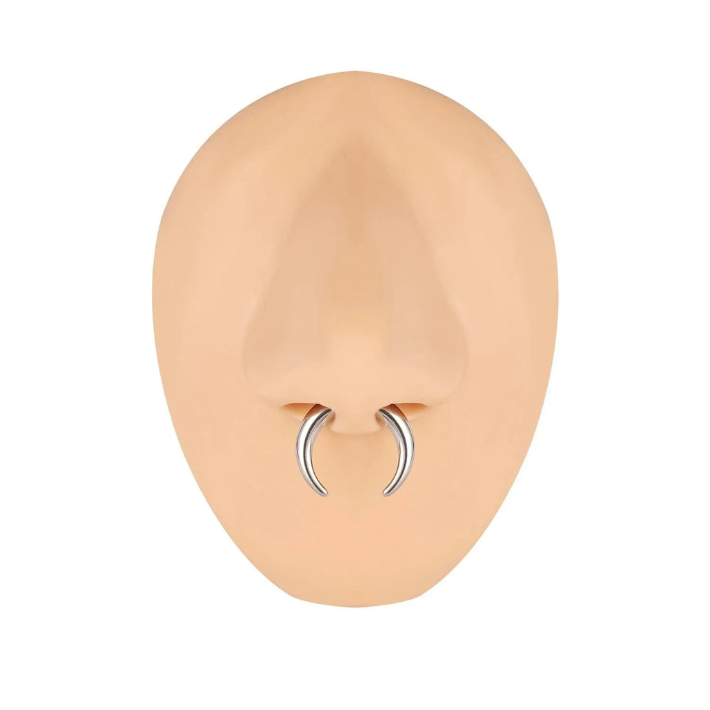 A black and steel coloured C-shaped geometric nose ring made from titanium steel and buffalo horn.