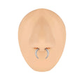 A black and steel coloured C-shaped geometric nose ring made from titanium steel and buffalo horn.