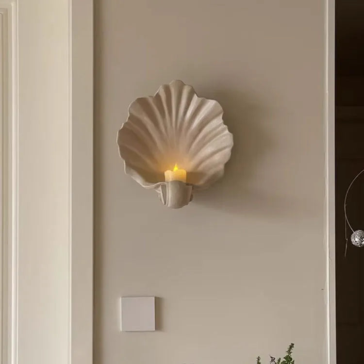 White resin shell-shaped ornament for fruit plate decoration on a table