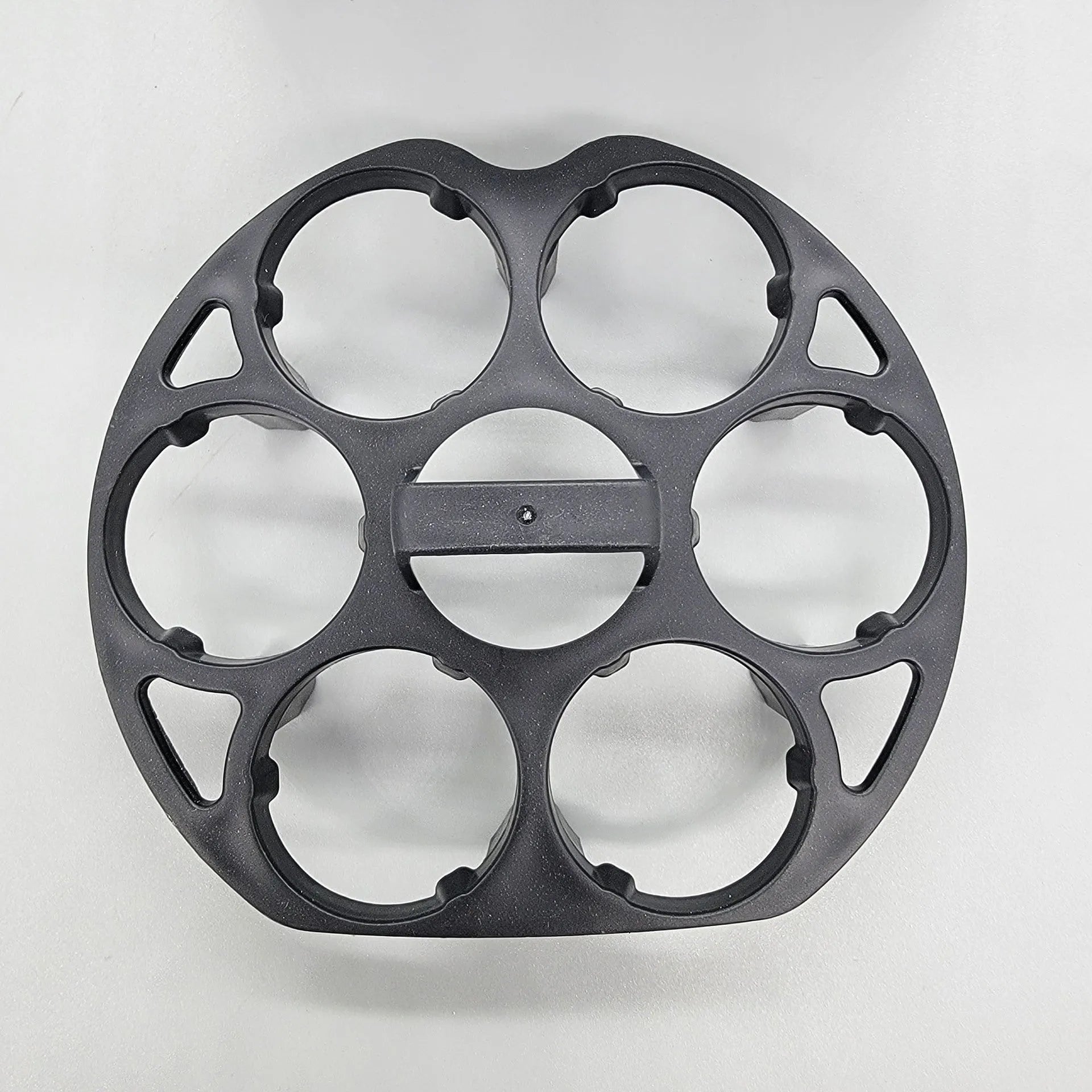 Black plastic egg cooking basket with modern design, shown with dimensions 13.8cm by 12.6cm by 5.7cm.