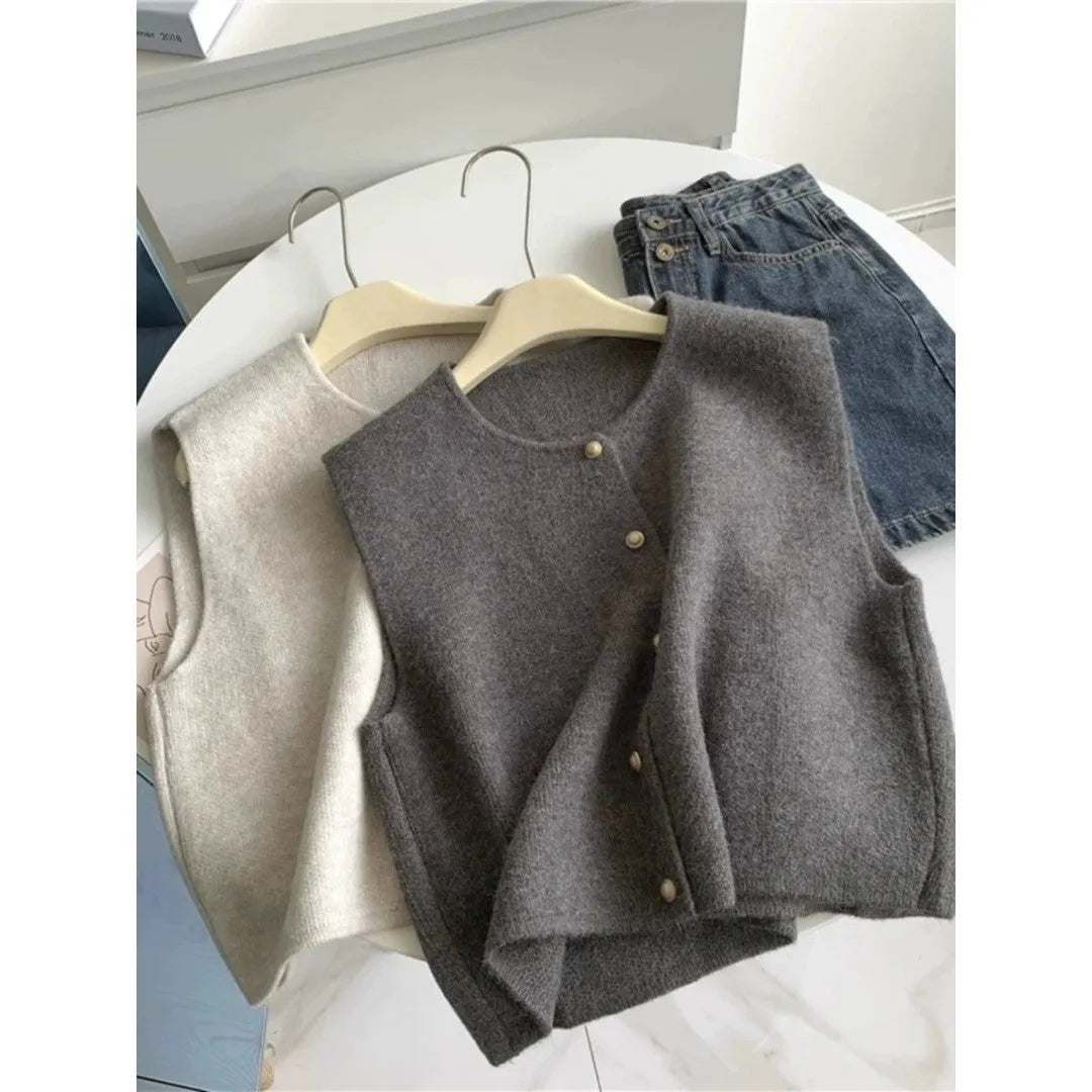 Women's thin polyester pullover vest with half sleeves in a choice of six colours on a hanger.
