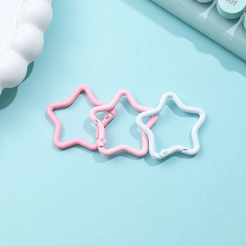 Zinc alloy five-pointed star keychain in light pink, one of ten available macaron colours.