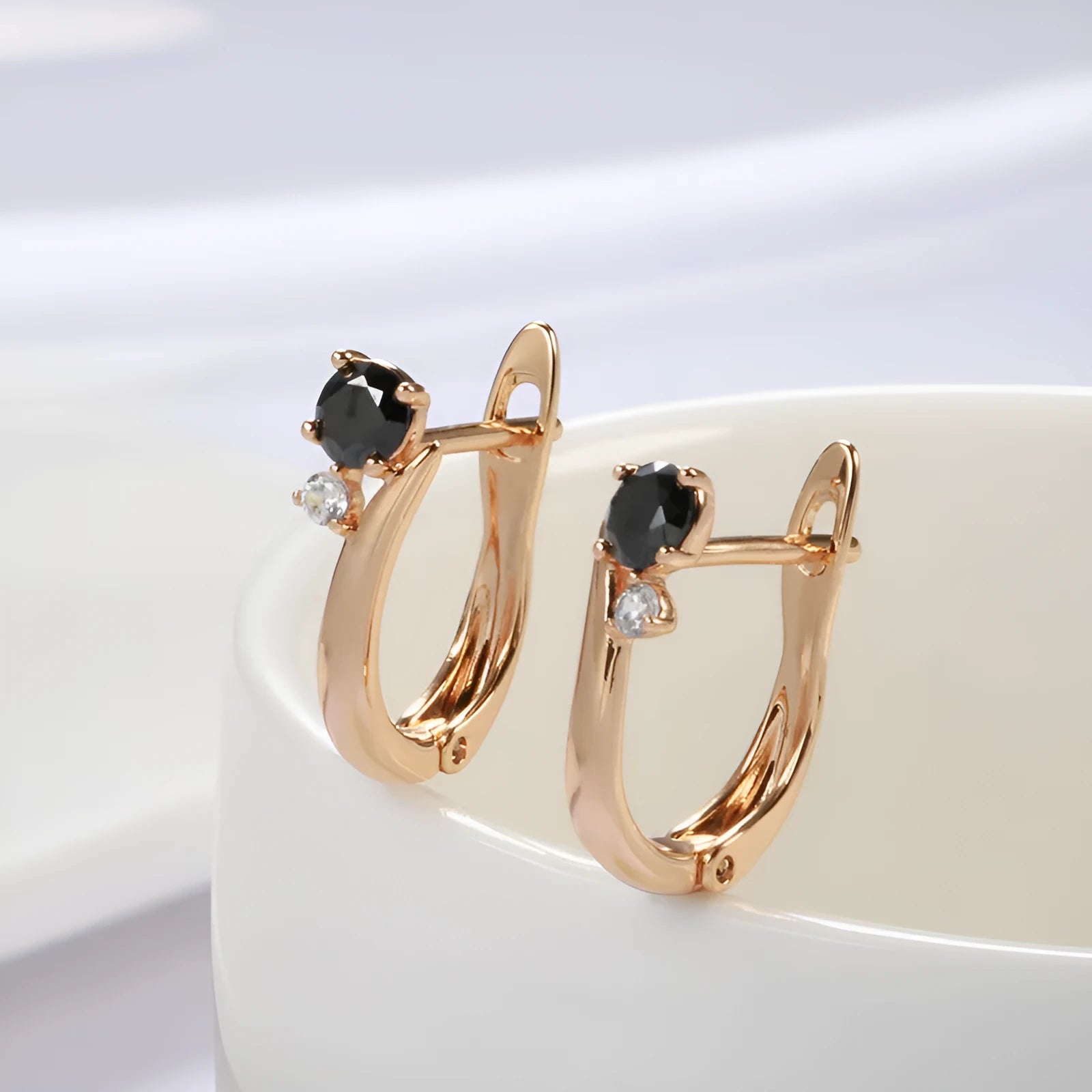 Gold geometric drop earrings with black agate inlay on copper