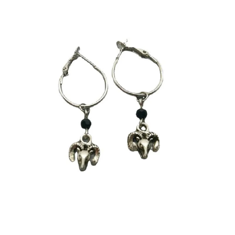 Silver coloured round ring earrings with Tibetan antelope design inspiration