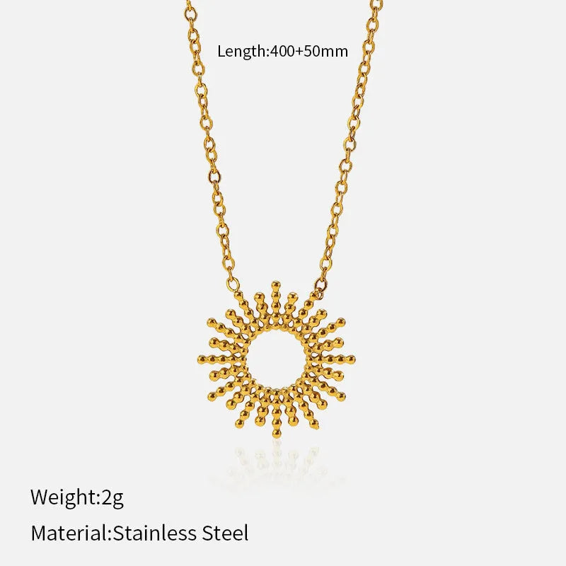 Women's gold geometric sunflower chain necklace and bracelet set on white background