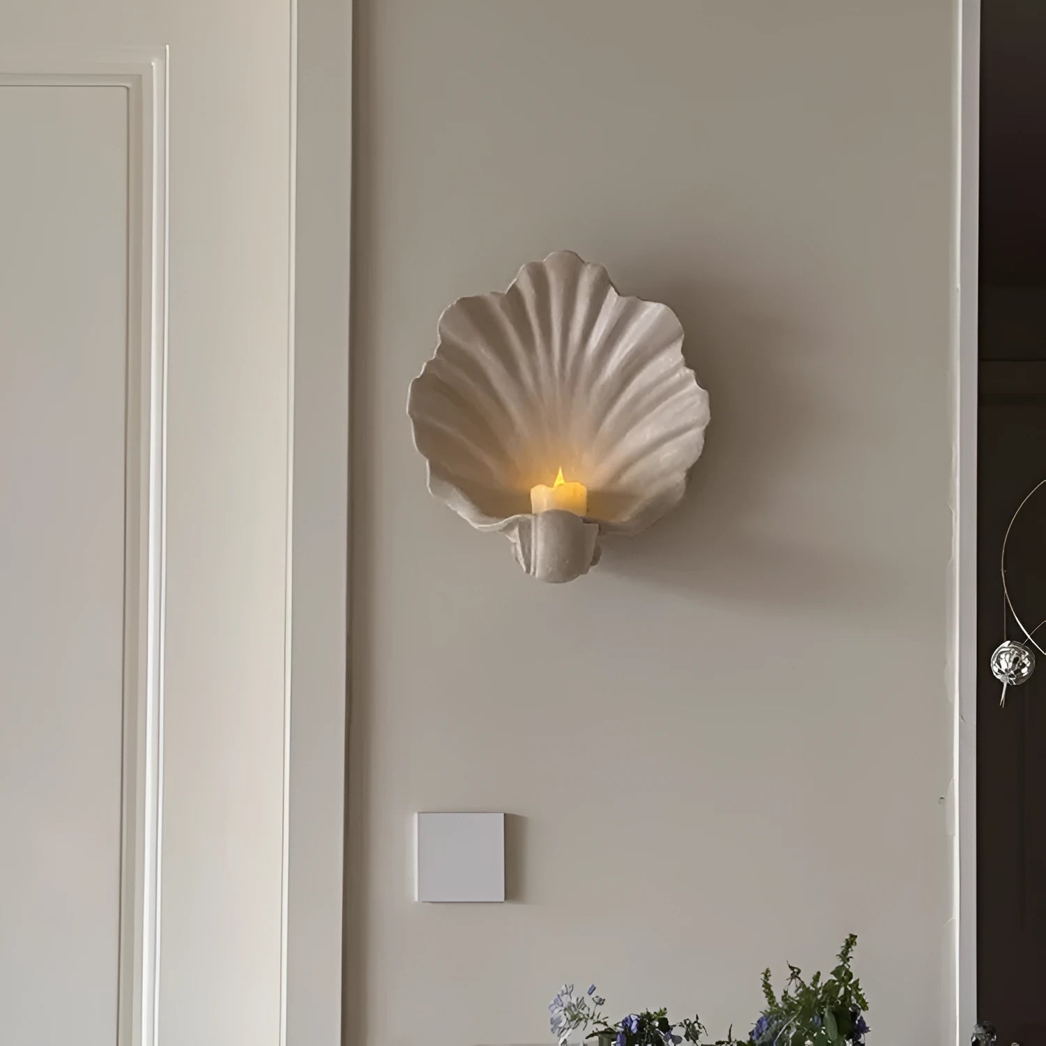 White resin shell-shaped ornament for fruit plate decoration on a table