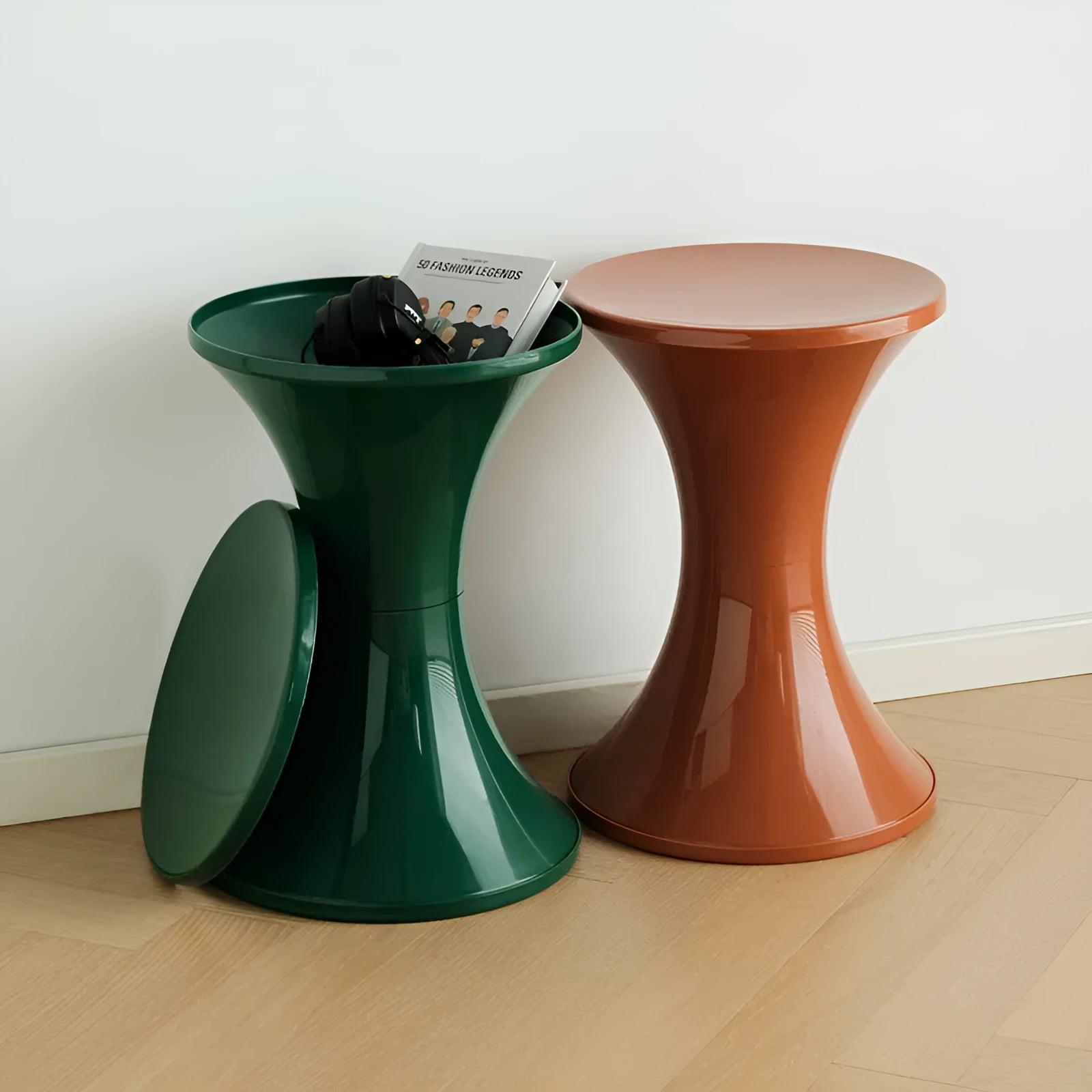 Hourglass-shaped plastic stool in green for changing shoes, used by an adult and child.