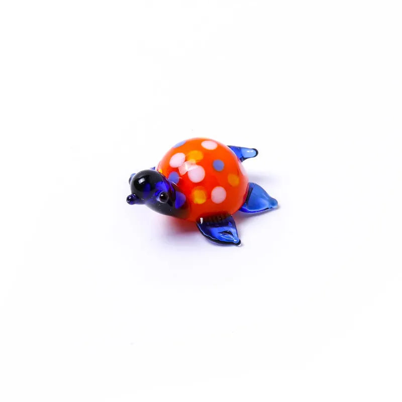 Glass turtle ornament with geometric modern design in six colour variations for desktop decoration