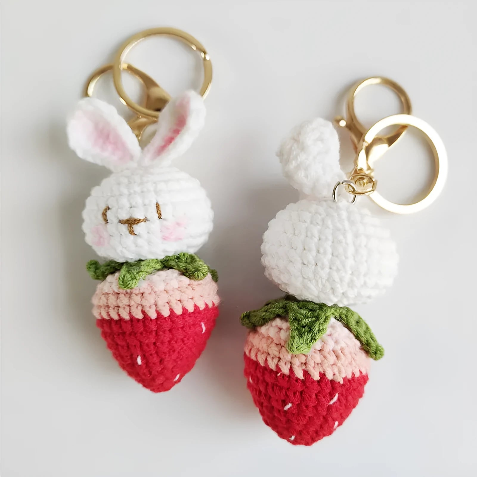 Hand-woven white wire pendant with rabbit strawberry pattern and attached key