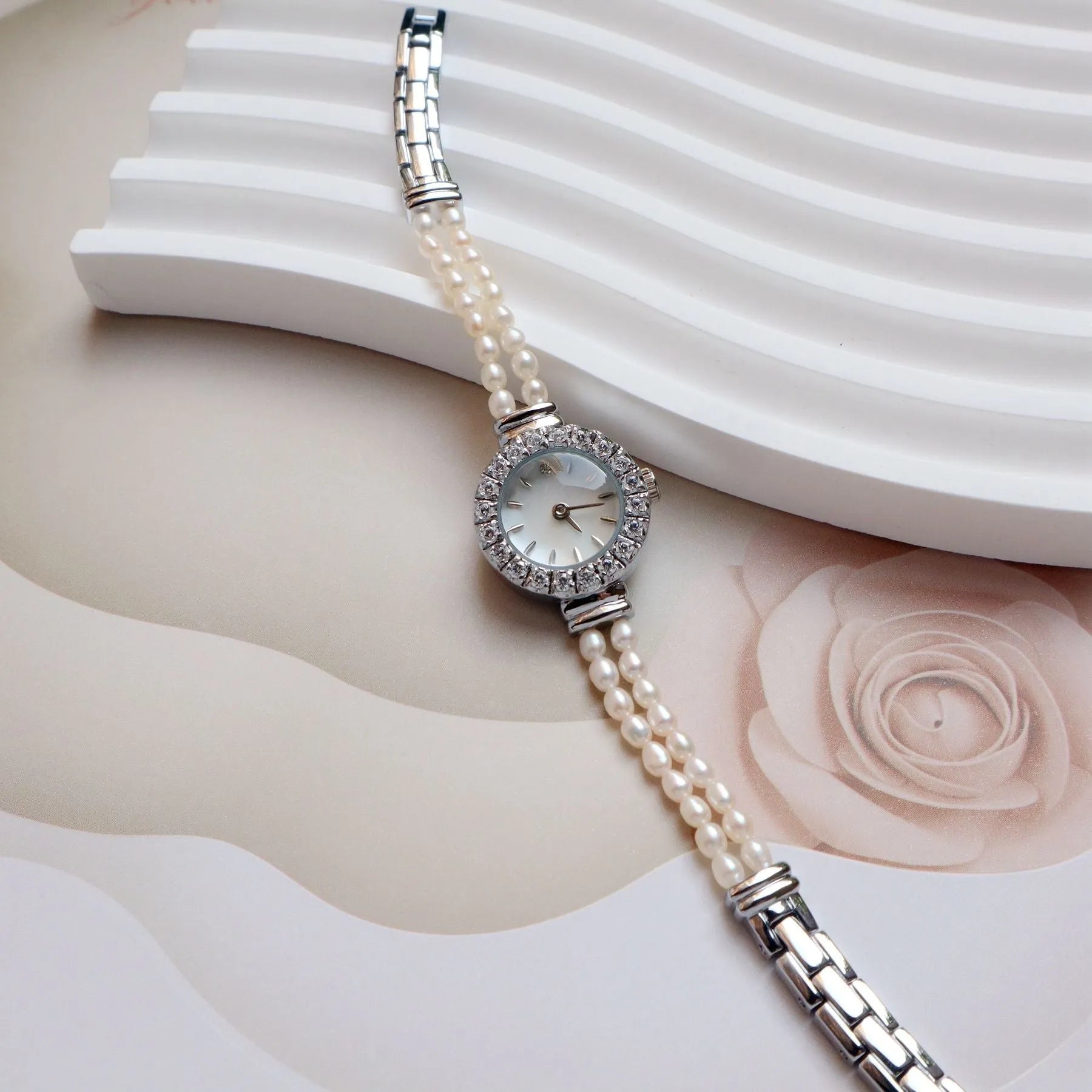 Women's light gold freshwater pearl bracelet watch with 18mm round dial and stainless steel construction