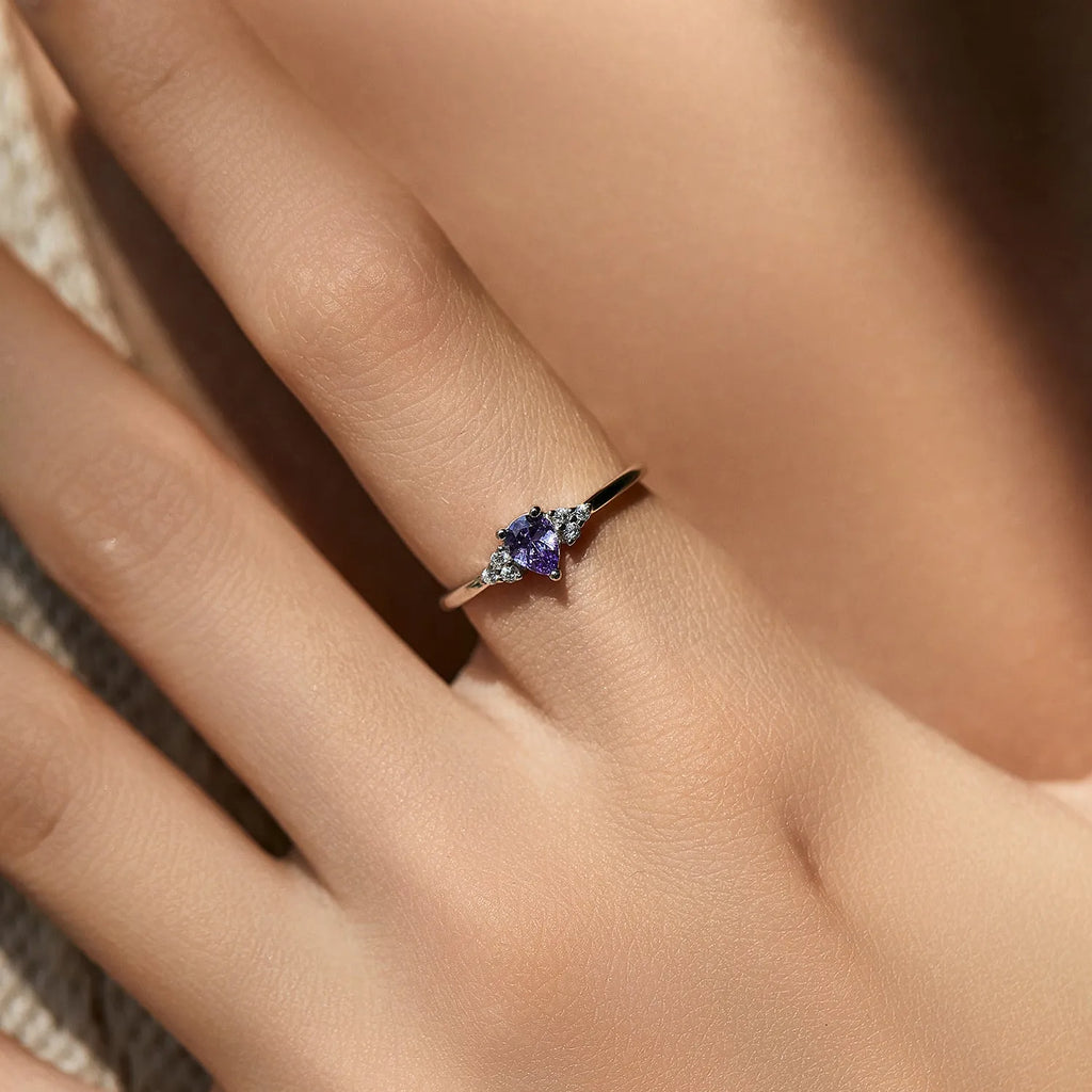 S925 sterling silver ring with purple crystal drop-shaped rhinestone on white background