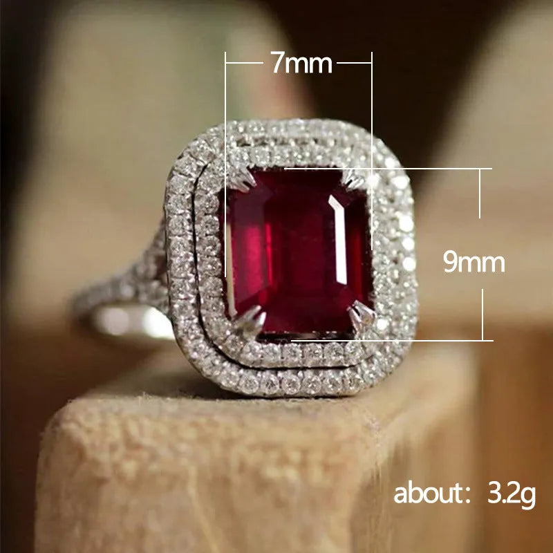 Women's geometric square copper ring with crystal rhinestones in red, showing princess design