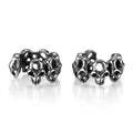 Stainless steel clip-on earrings with a hollow geometric skull design.