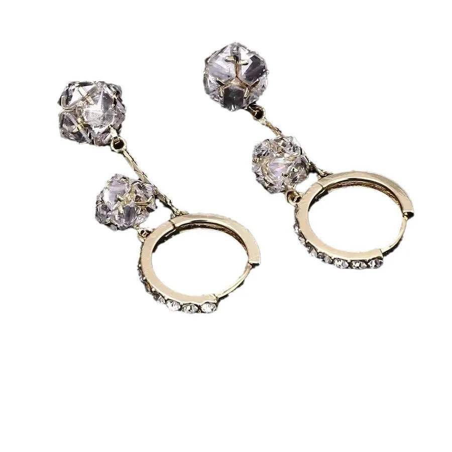 Silver coloured women's earrings with tassel ball and rhinestone ball pendants on ear clips