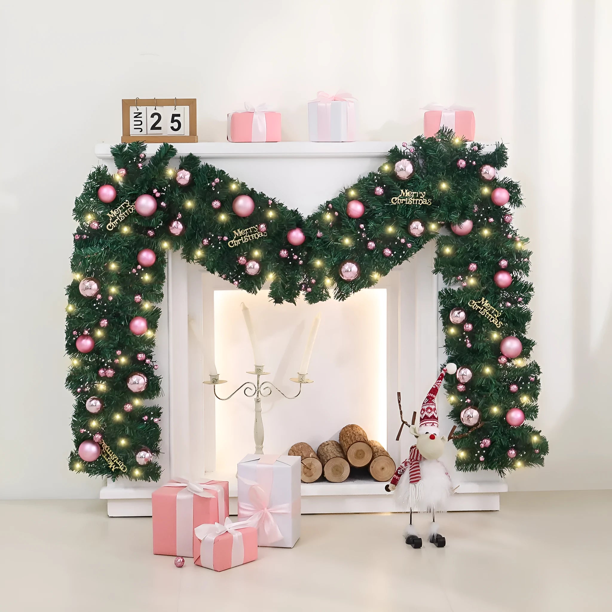 2.7 metre long pink artificial Christmas rattan vine decoration with small berries and leaves against a wall.