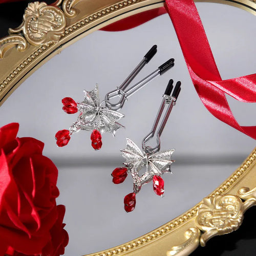 Silver diamond bat nipple clamp adjustable clitoral clip jewellery on black background
