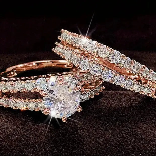 A 2 in 1 set of fully-jewelled geometric rings for women, shown in rose gold, silver, and gold colour options.