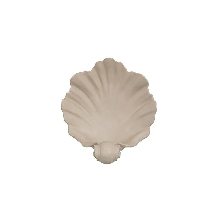White resin shell-shaped ornament for fruit plate decoration on a table
