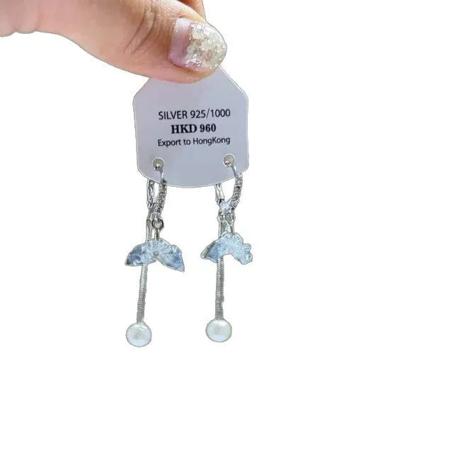 Silver geometric heart-shaped clip-on earrings with rhinestones and a dangling star tassel charm.
