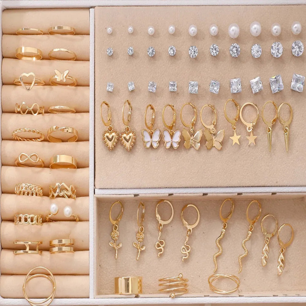 108 geometric pearl earrings assortment showing gold and yellow electroplated colours on alloy construction