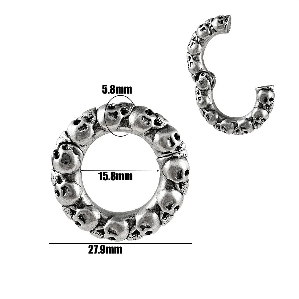 A pair of stainless steel fashion earrings featuring a geometric totem pattern with an electroplated coloured finish.