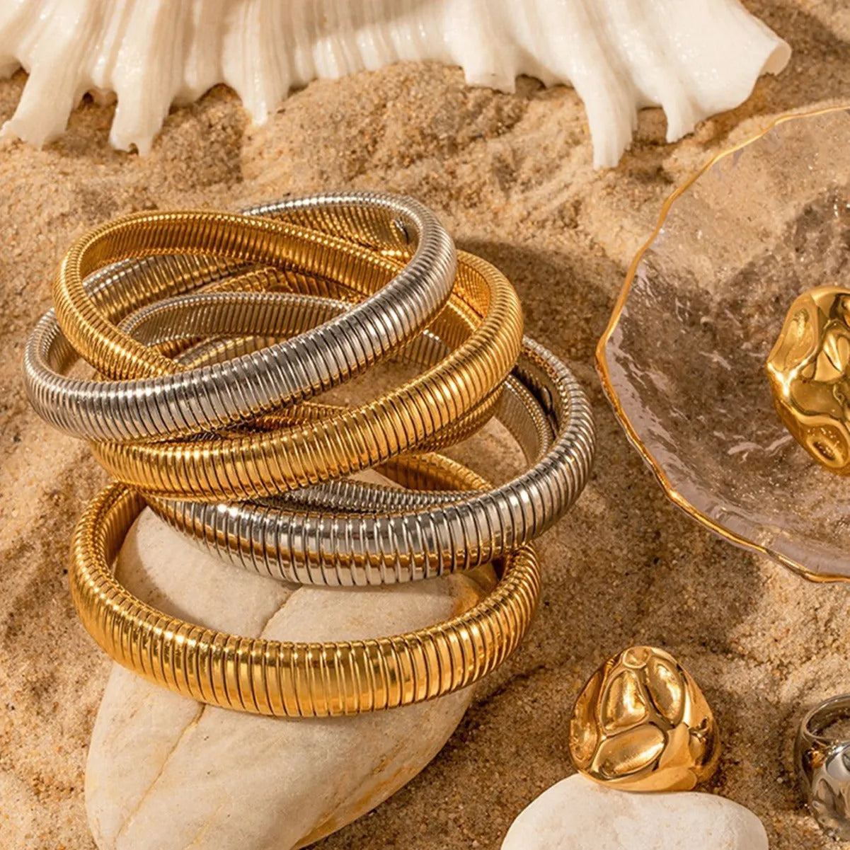 Gold titanium steel bracelet with elastic band and exaggerated vertical stripe ring design