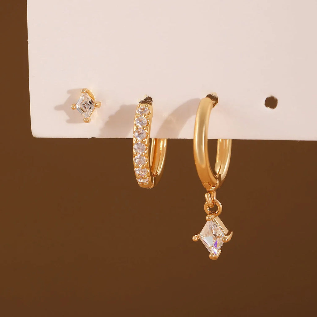 Geometric pattern copper earring set with zircon stones in clip, stud, and dangle styles
