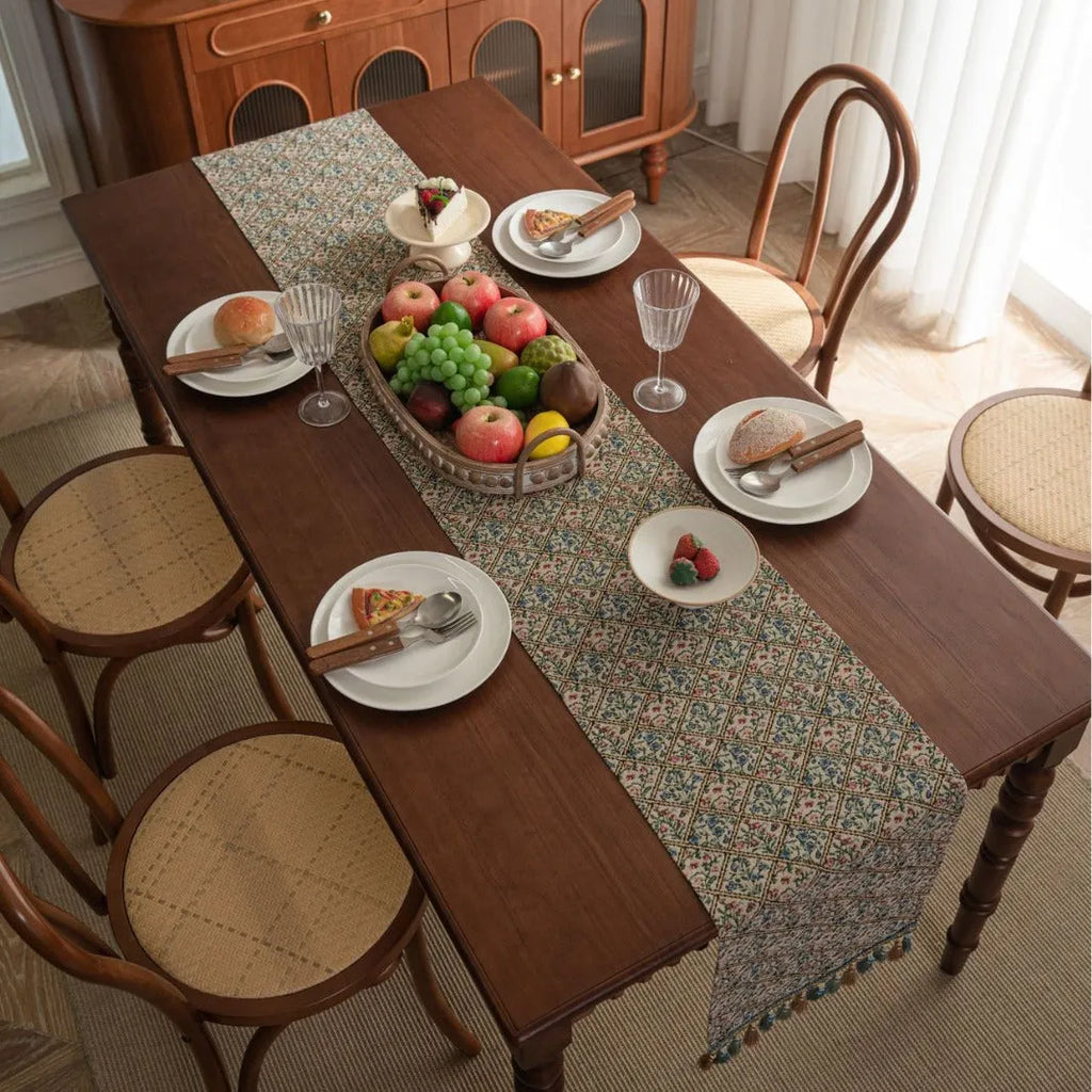 Nordic jacquard bouquet pattern table runner with striped design and decorative tassel fringe in dark blue