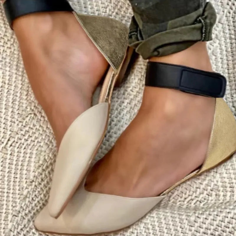 Women's beige velcro-strap hollowed flat sandals with a PU upper on a plain background.