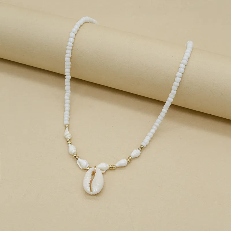 Cold Wind white conch shell necklace with mother-of-pearl pendant on regular chain