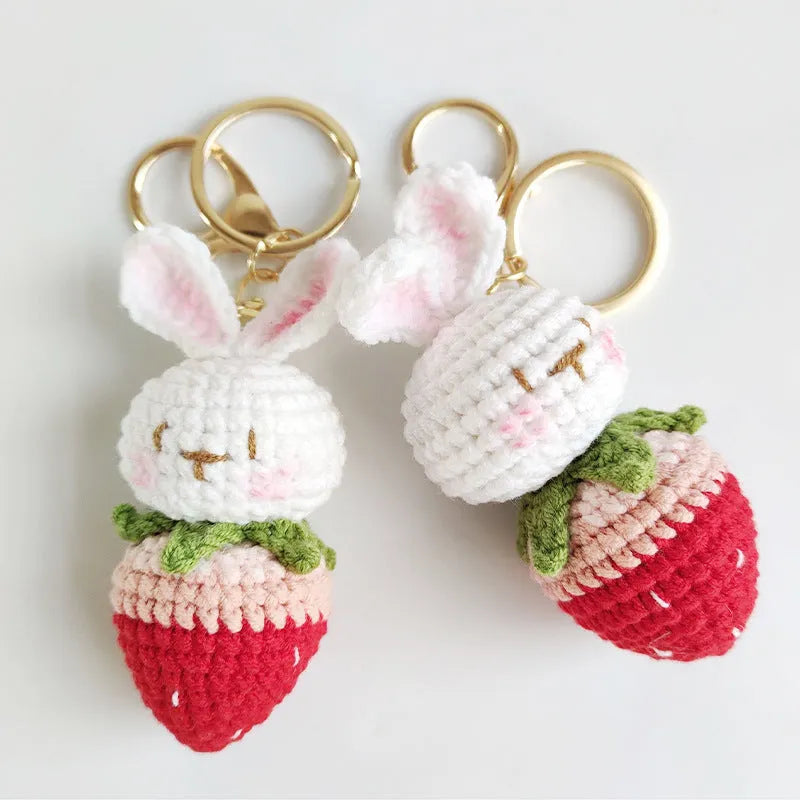 Hand-woven white wire pendant with rabbit strawberry pattern and attached key