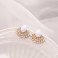 Retro geometric fan-shaped women's earrings with opal and rhinestone details on a silver-coloured background.
