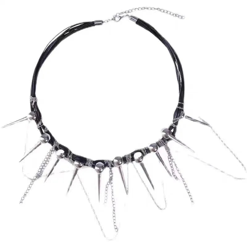 Leather necklace with winding round beads, tassel detail, and electroplated point rivets in casual style.