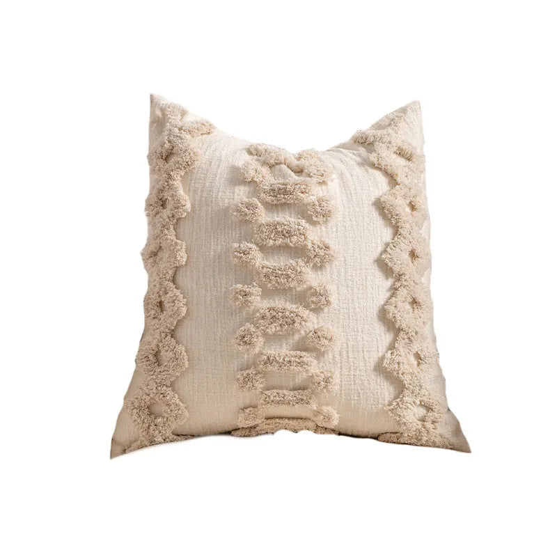 Knitted cushion cover with tassel trim in a printed spiral dots pattern, shown in 45x45cm size.