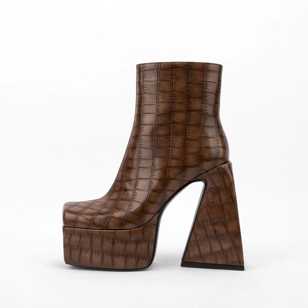 Women's artificial PU ankle boots with a high heel, shown in beige colour.