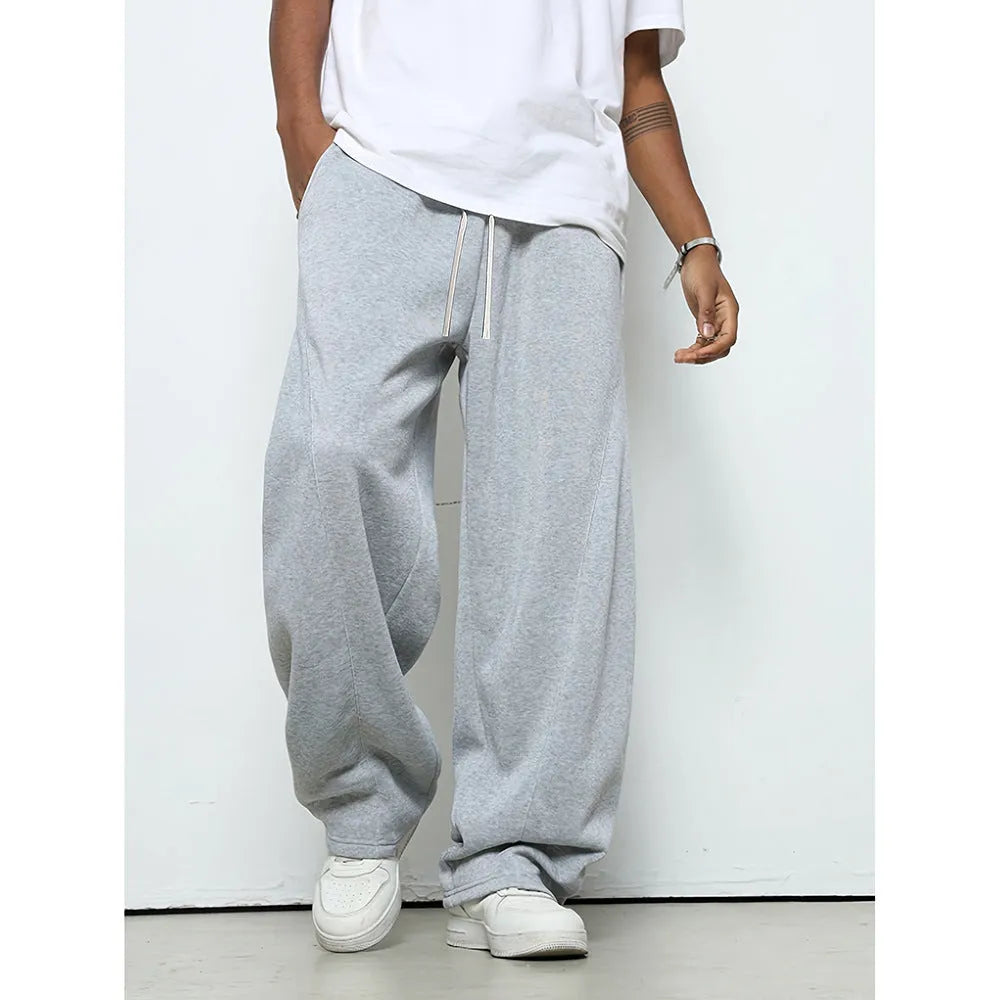 Men's straight-leg casual trousers in polyester with an elasticated waist, shown in black, grey and light grey.