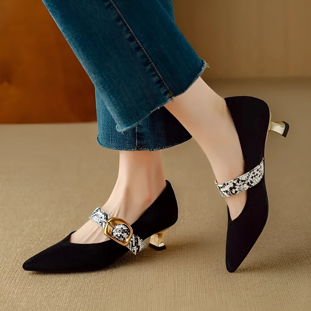 Black pointed toe women's stiletto heels with a buckle fastener on the side.