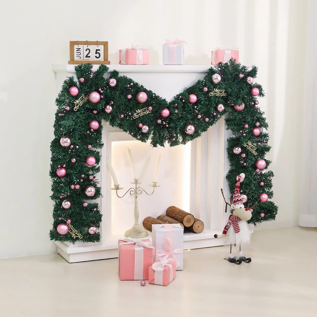 2.7 metre long pink artificial Christmas rattan vine decoration with small berries and leaves against a wall.
