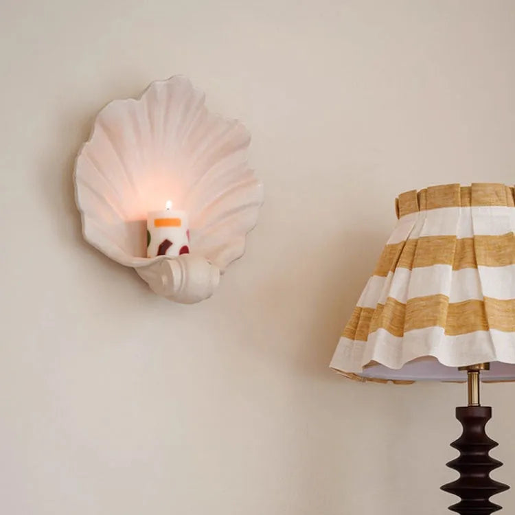 White resin shell-shaped ornament for fruit plate decoration on a table