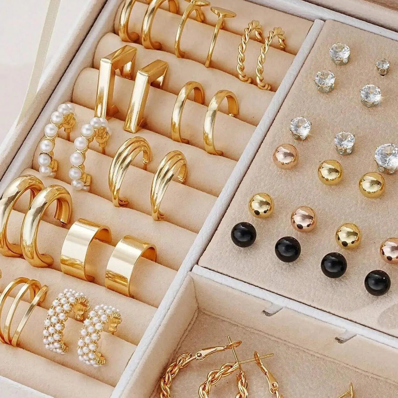 108 geometric pearl earrings assortment showing gold and yellow electroplated colours on alloy construction