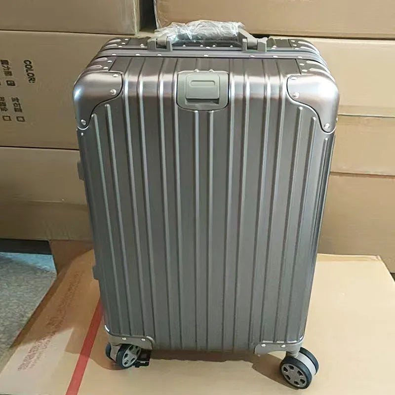 Alloy trolley case luggage in silver colour with metal frame and universal wheels for business travel