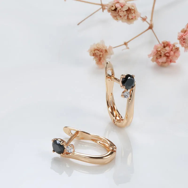 Gold geometric drop earrings with black agate inlay on copper