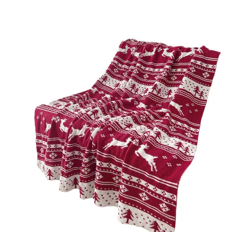 Christmas blanket with cartoon snowflake design in red and white colours