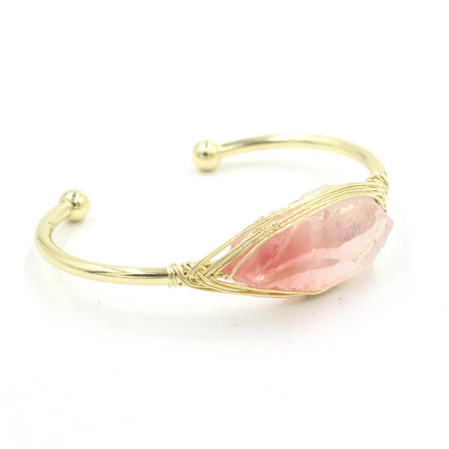 Natural raw gemstone winding bracelet with amethyst, pink crystal, and green fluorite stones on a string with a clasp.