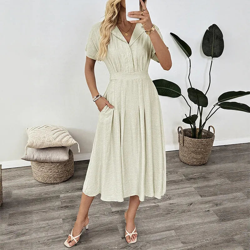 Light green women's shirt dress with lapel collar, waist tie, and side pockets on a model.