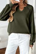 Women's loose-fit sweater in apricot with a half-open collar, lace stitching detail, and long sleeves.